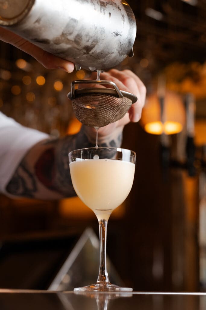 cocktail pouring at restaurant bar and grill